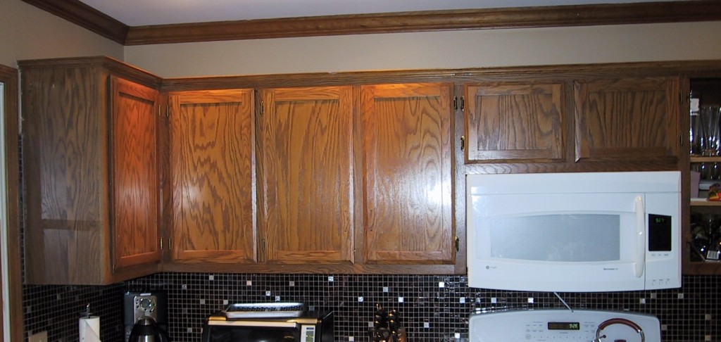 Basic oak builder's grade cabinets that we will be refacing in solid cherry