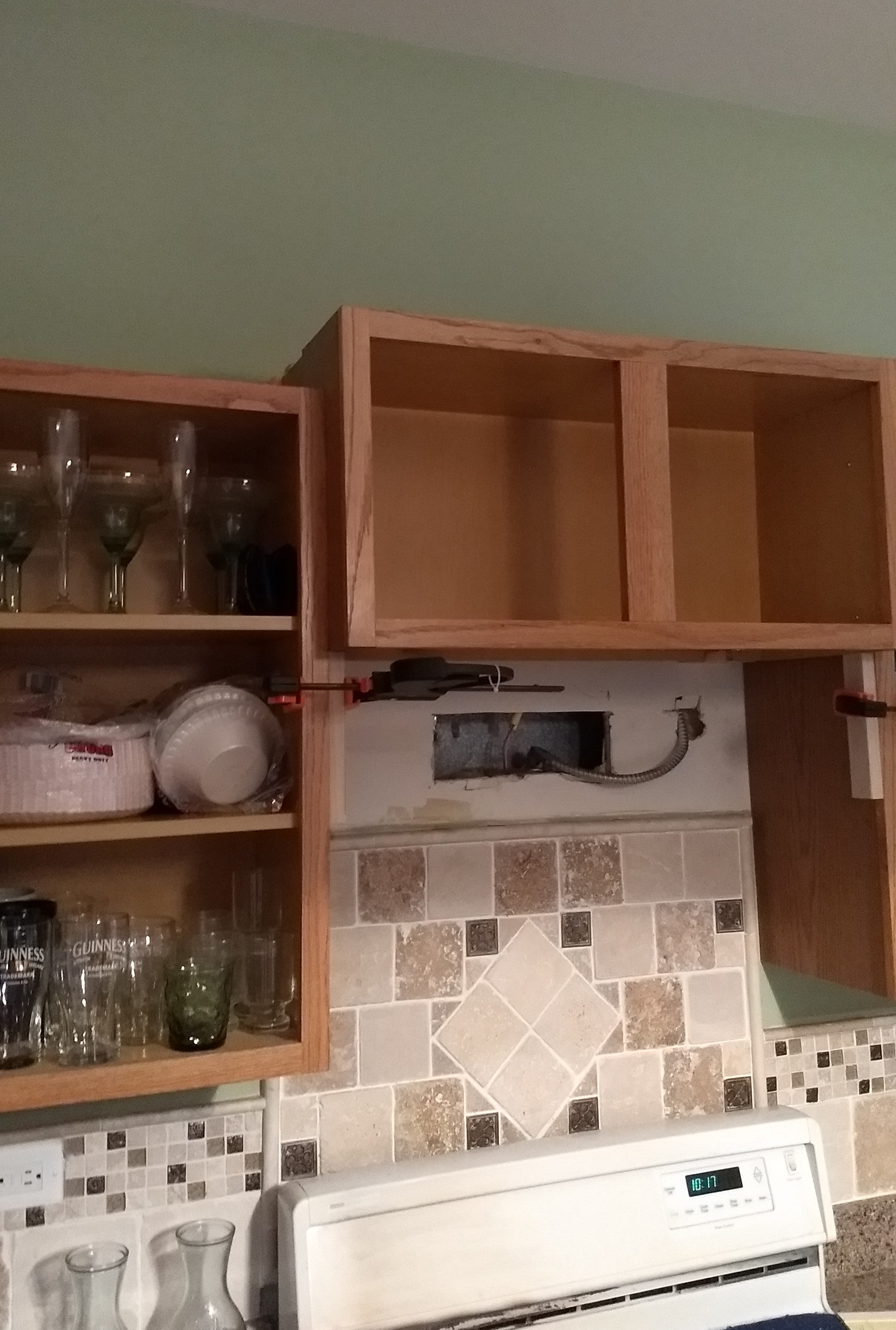 Step 4: the old cabinet is remounted to the side cabinets and the spacer blocks behind it