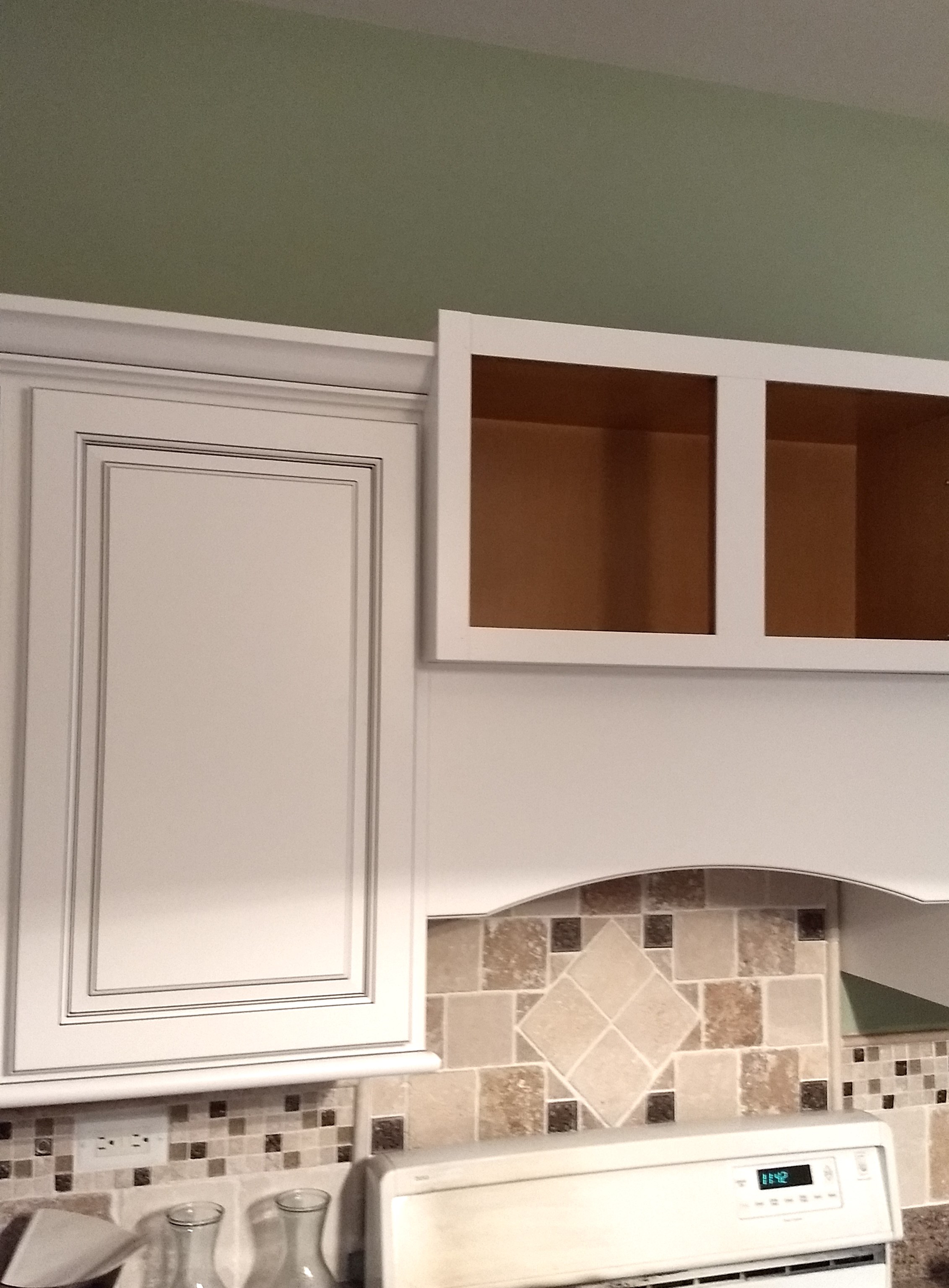 Step 7: I'm in the process of refacing the center cabinet and added a valance below to conceal a new vent